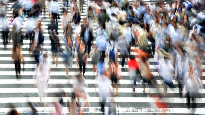 Motion blur on people walking across a crosswalk